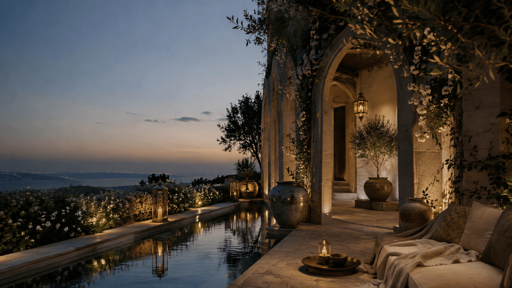 A tranquil illuminated terrace overlooking distant hills at dusk